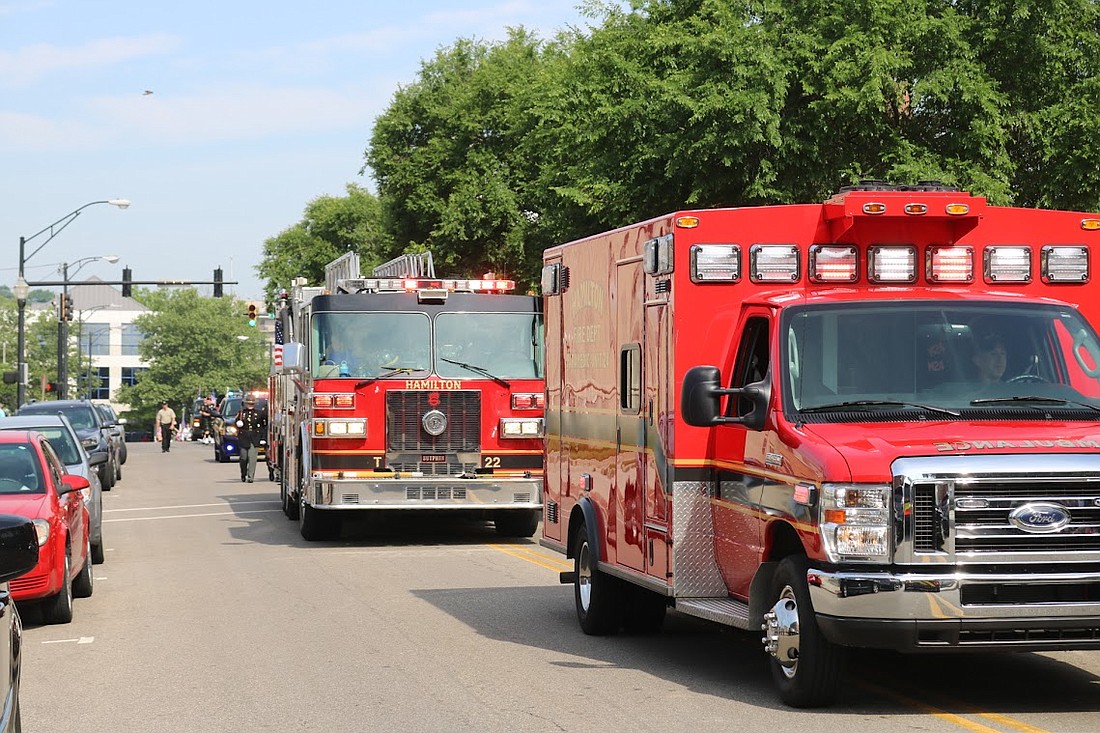 EMS and firetruck in a parade.